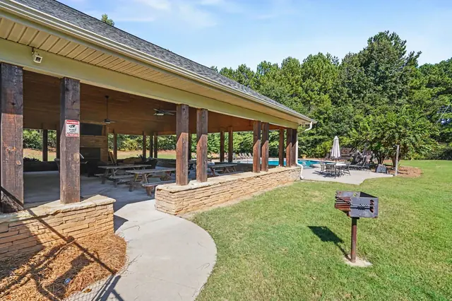 Covered community pavilion with a grill